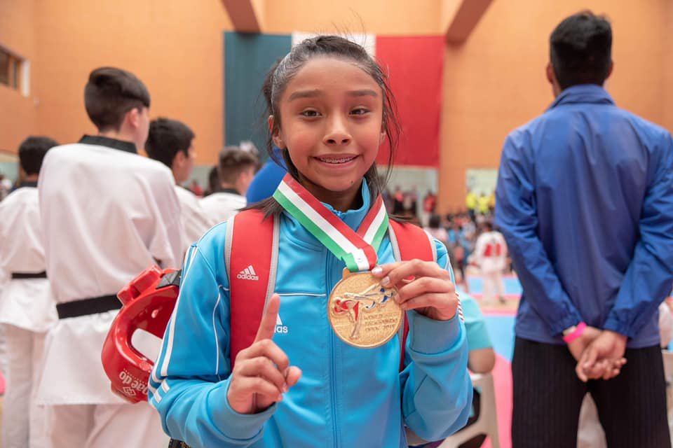 xtc student sparring with gold medal