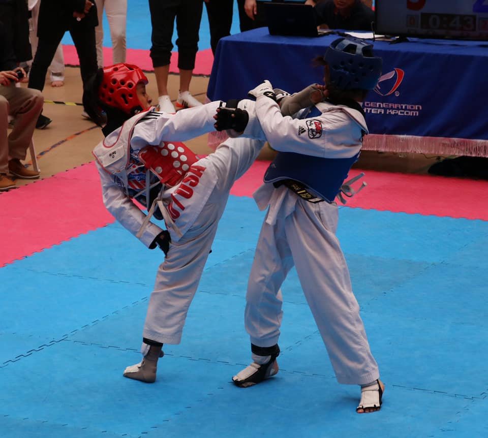 xtc taekwondo student kicking to the head